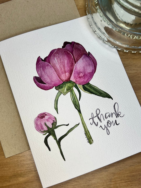 peony bud next to pink peony flower on thank you card